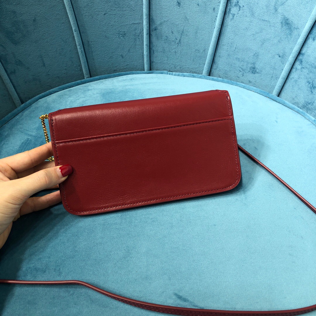 YSL CASSANDRE PHONE HOLDER WITH STRAP