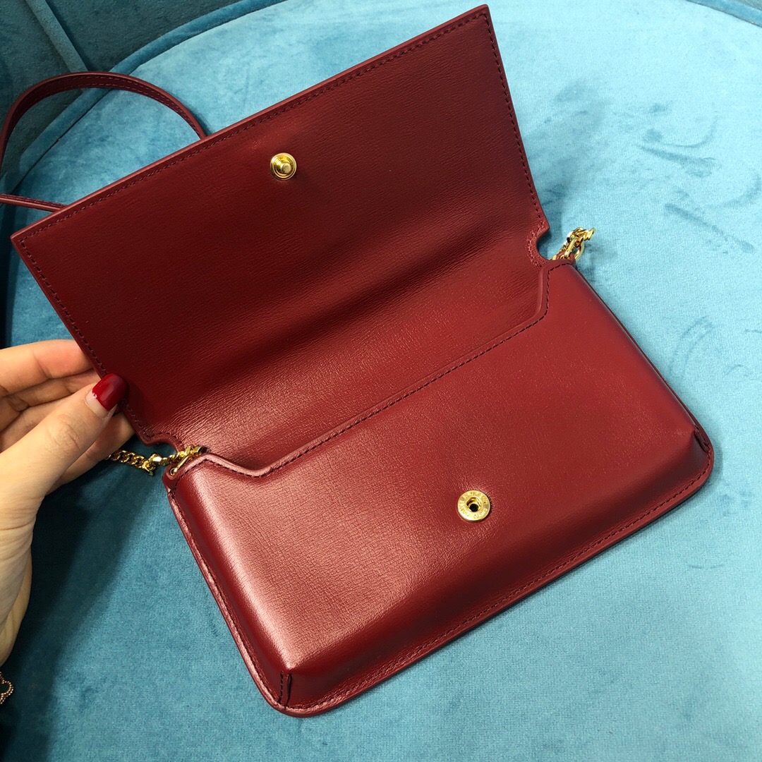 YSL CASSANDRE PHONE HOLDER WITH STRAP