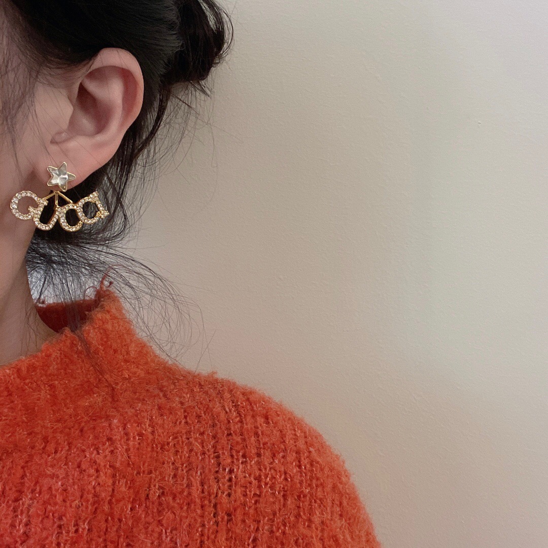 G*u*i earring
