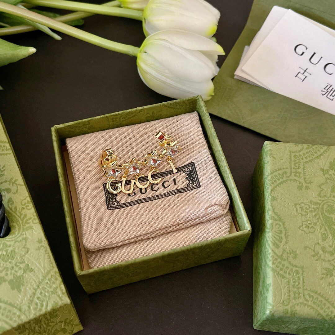 G*u*i earring