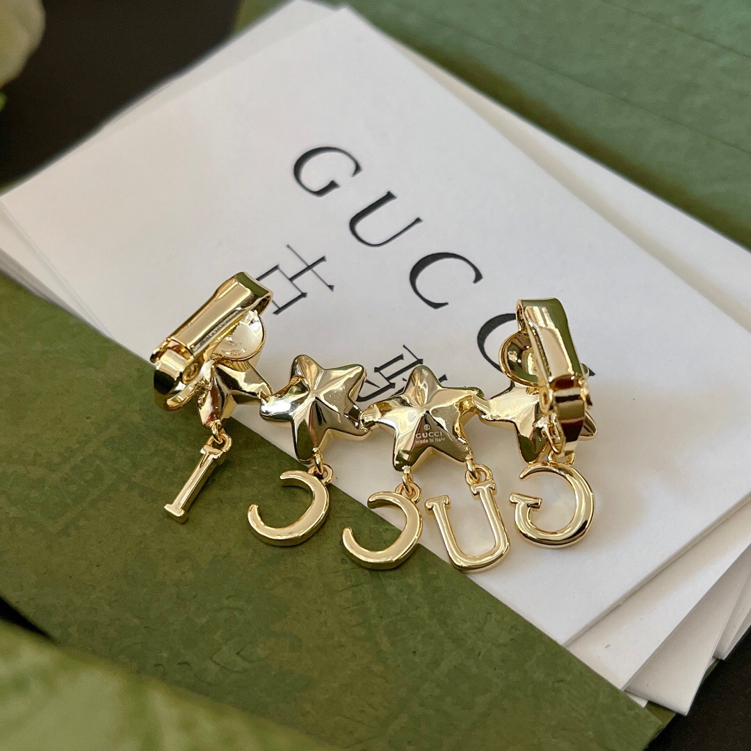 G*u*i earring