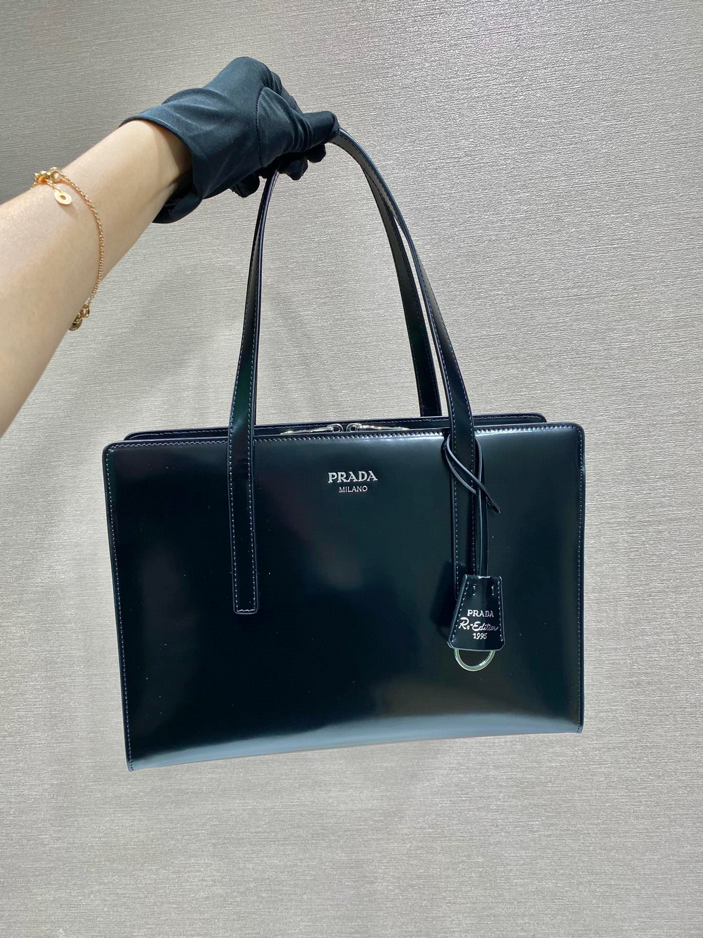 Pra*a re-edition 1995 brushed-leather medium handbag