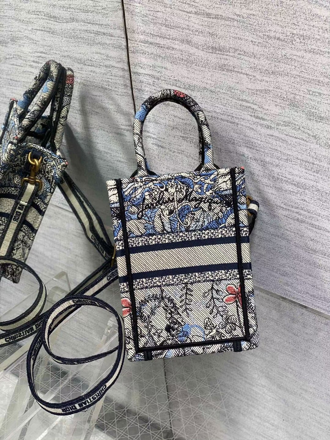 mini D*or book tote phone bag