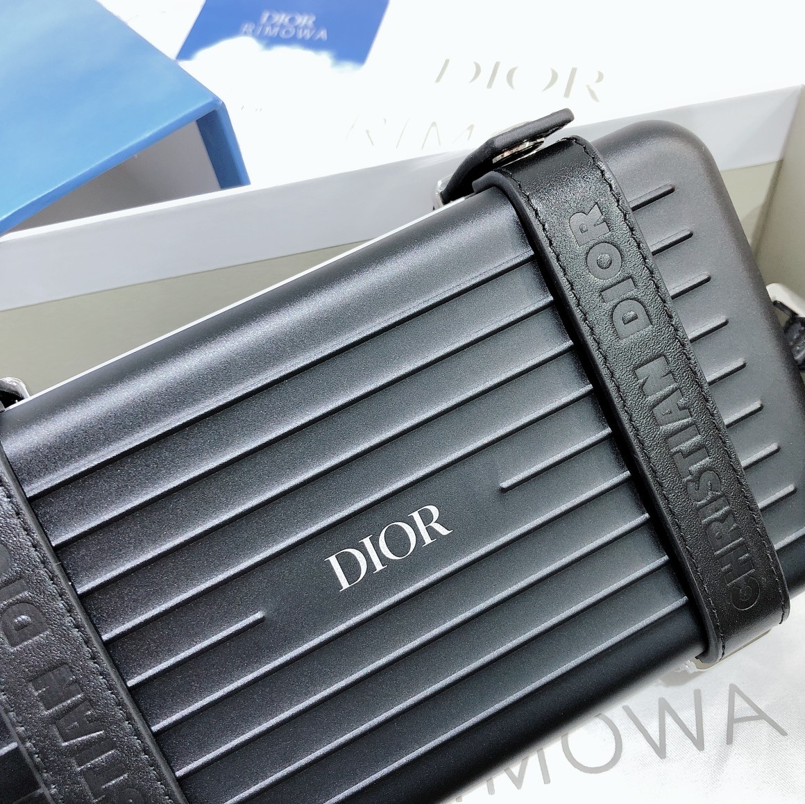 D*or and rimowa black trunk