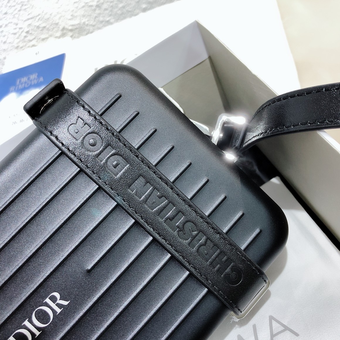 D*or and rimowa black trunk