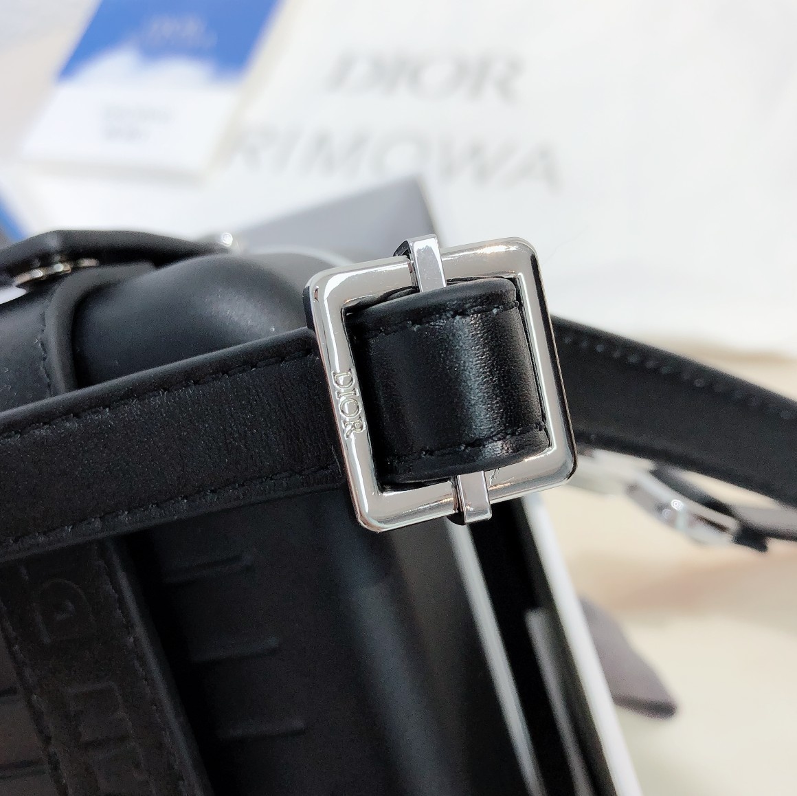 D*or and rimowa black trunk