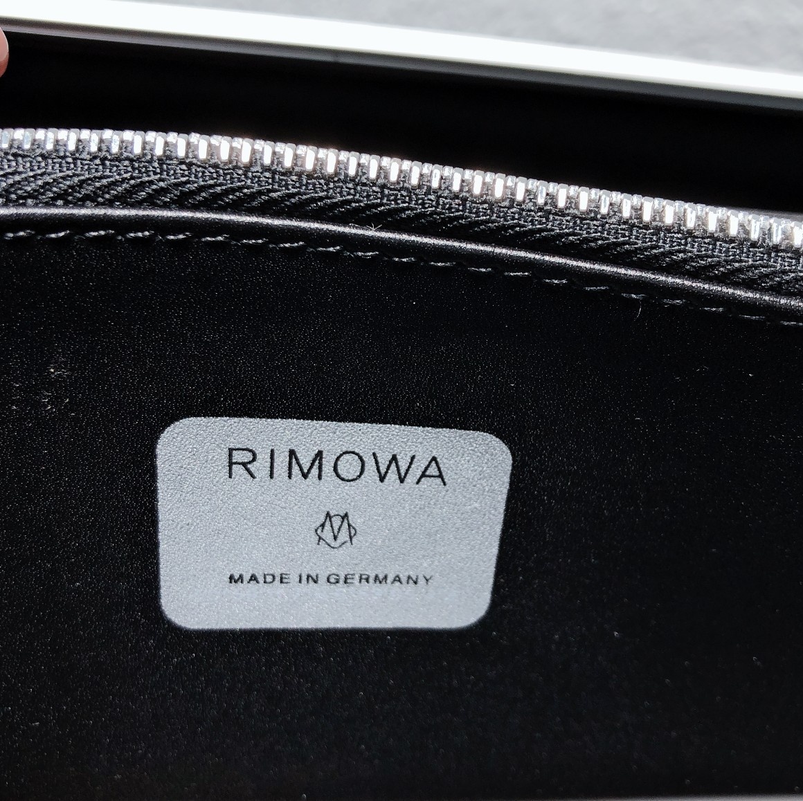 D*or and rimowa black trunk