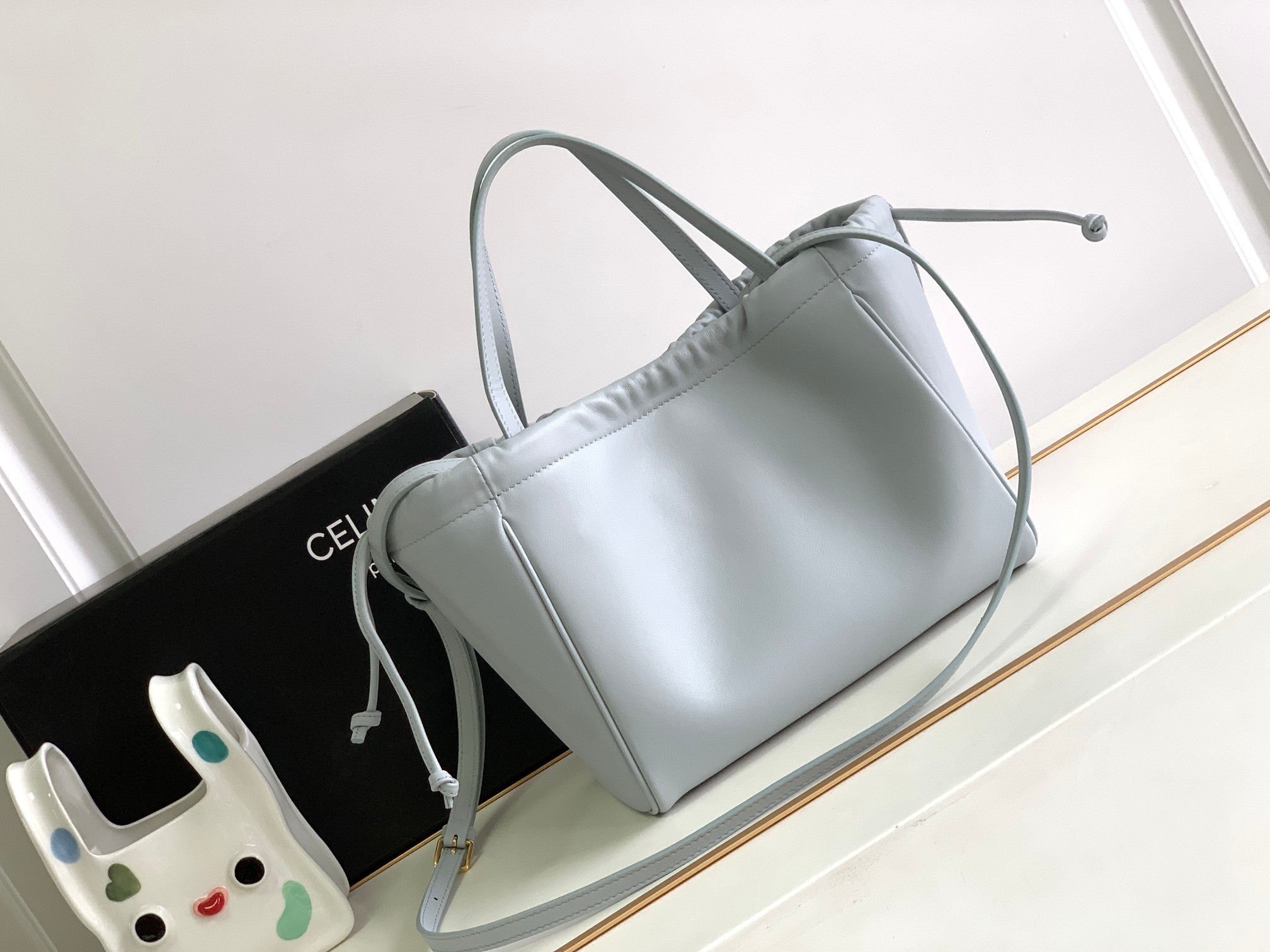 Ce**e small cabas drawstring cuir triomphe