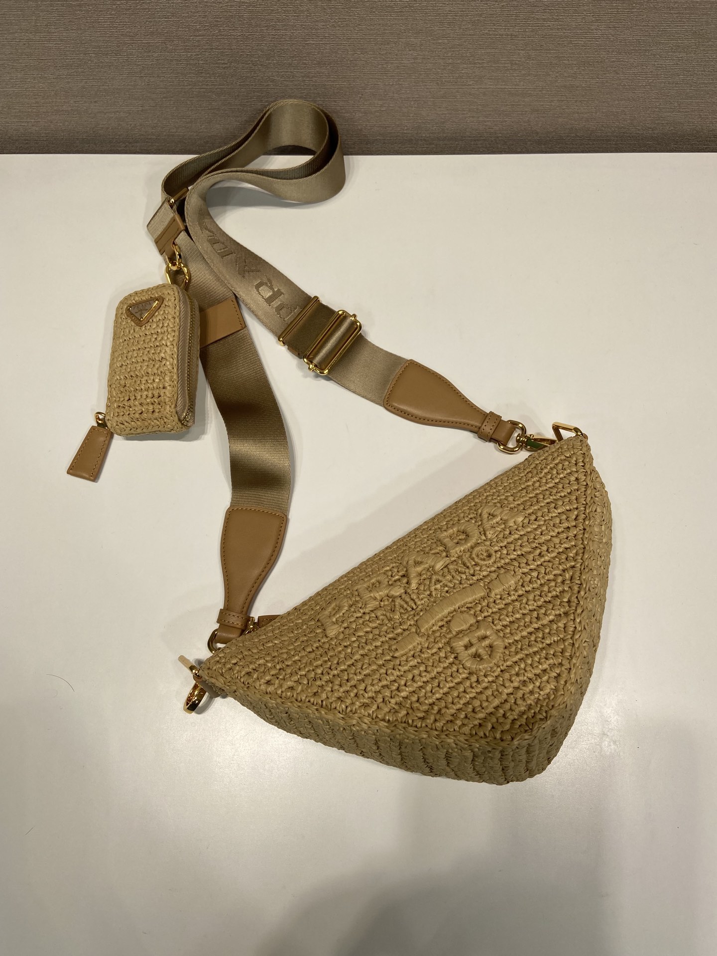 Pra*a triangle shoulder bag