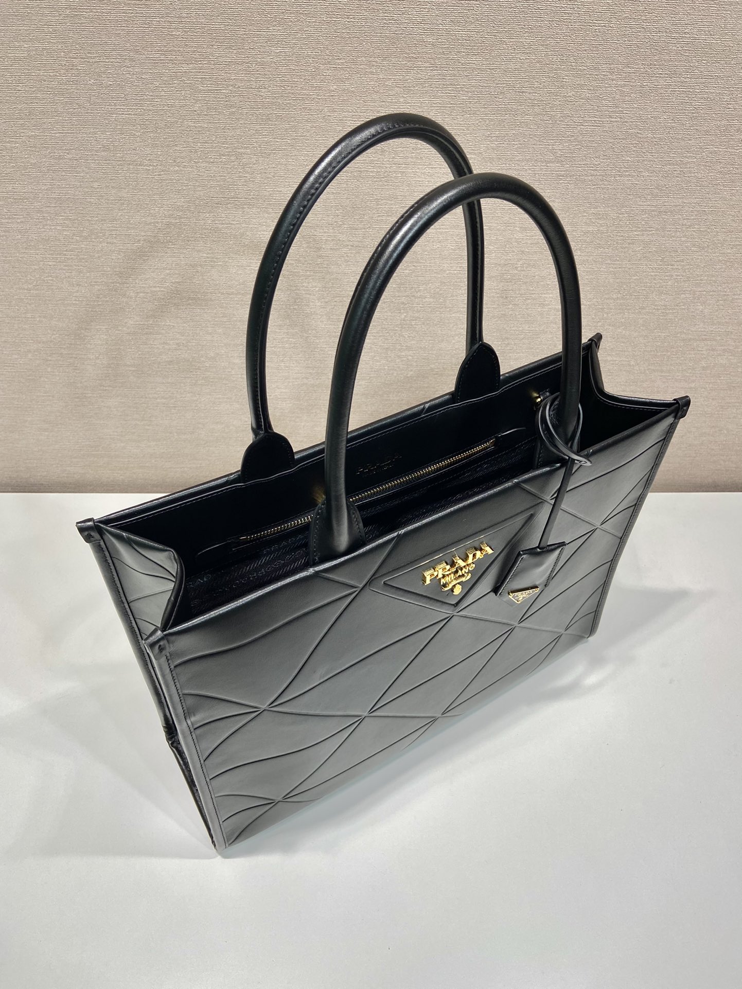 Pra*a large leather Pra*a symbole bag with topstitching
