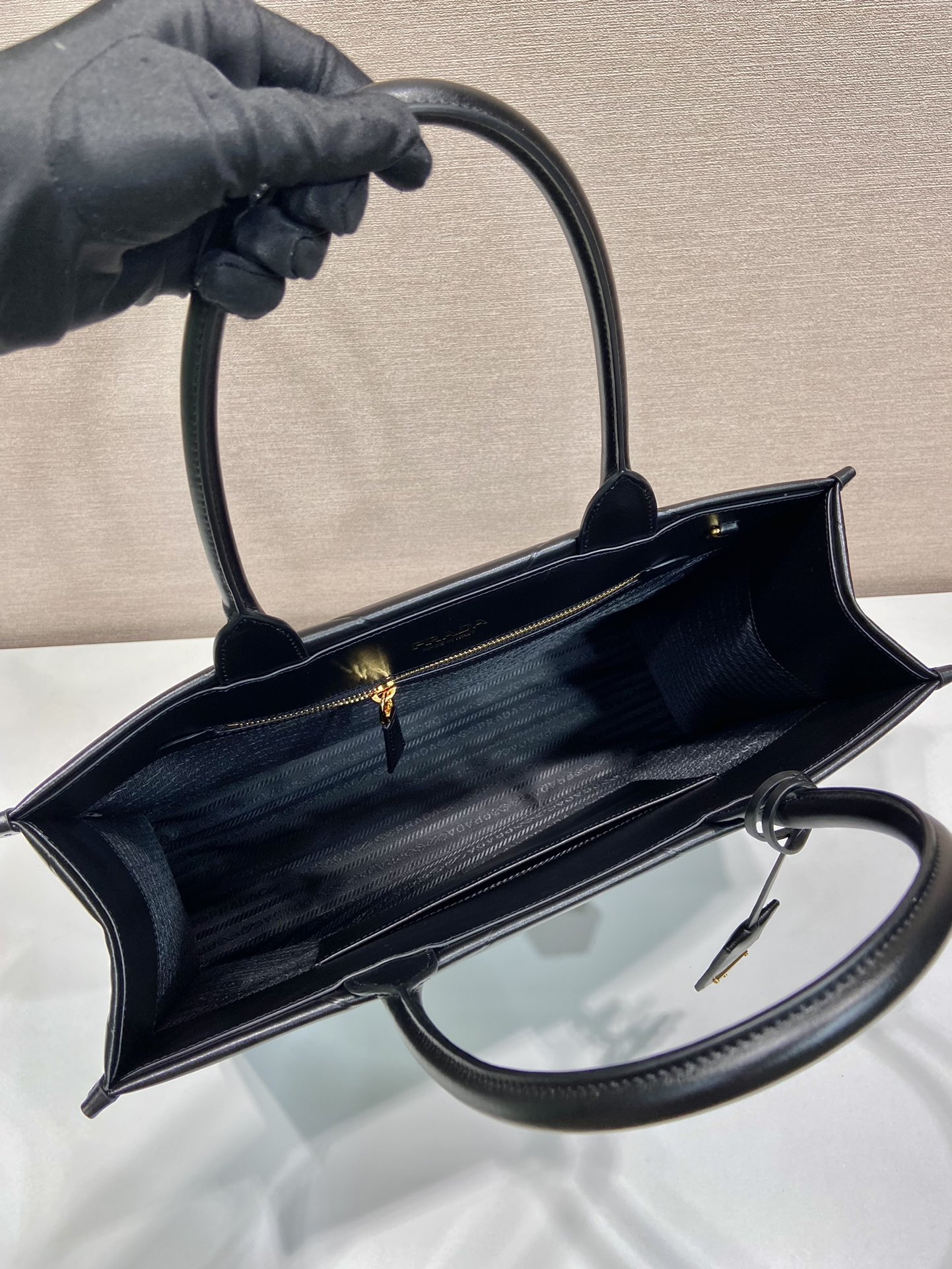 Pra*a large leather Pra*a symbole bag with topstitching