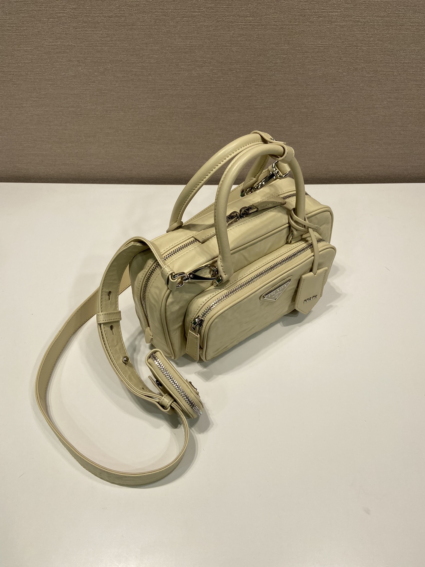 Pra*a antique nappa leather multi-pocket top-handle bag