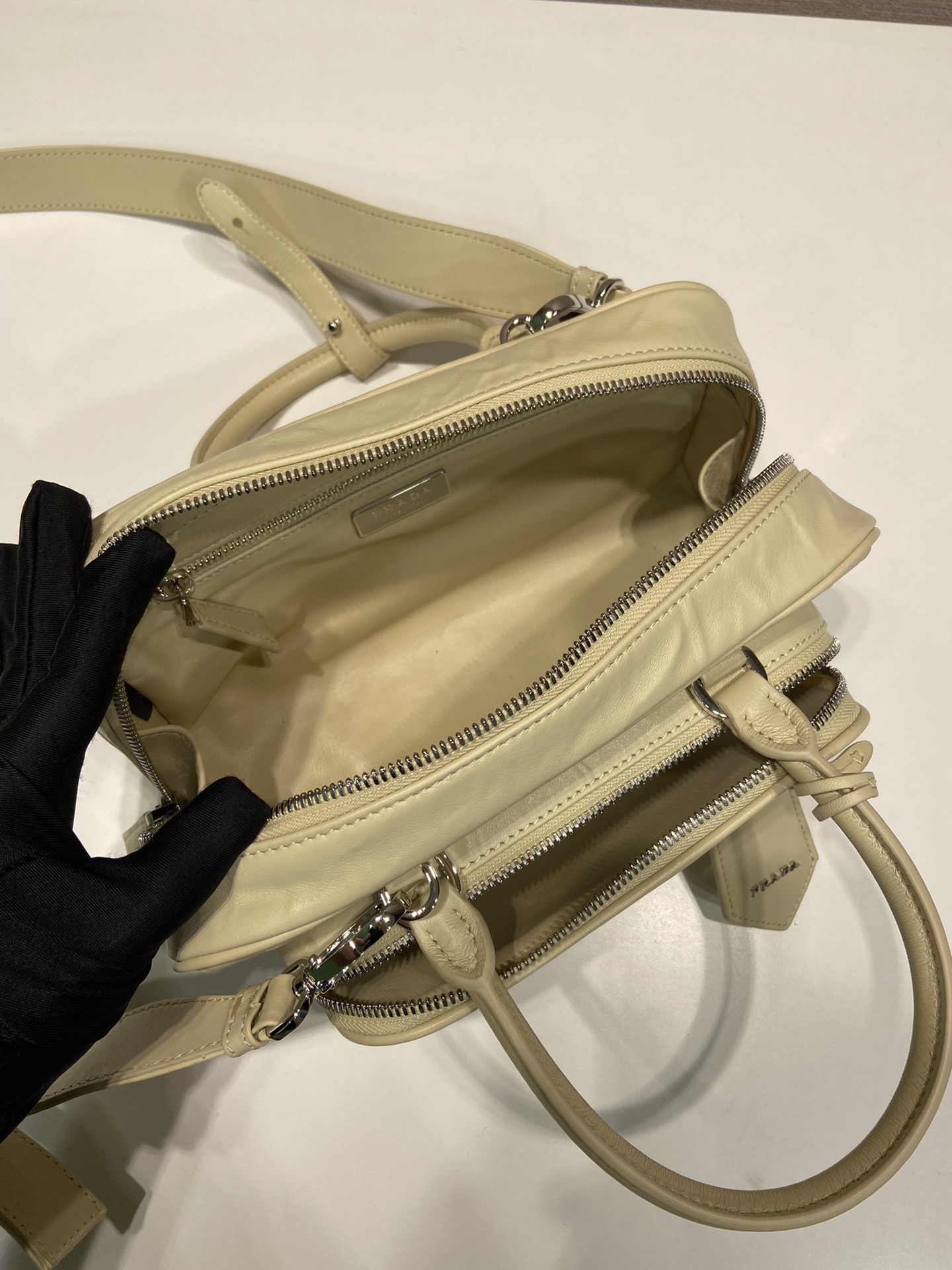 Pra*a antique nappa leather multi-pocket top-handle bag
