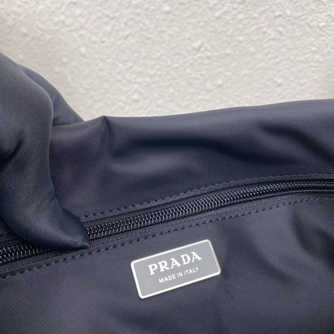 Pra*a black medium padded re-nylon shoulder bag