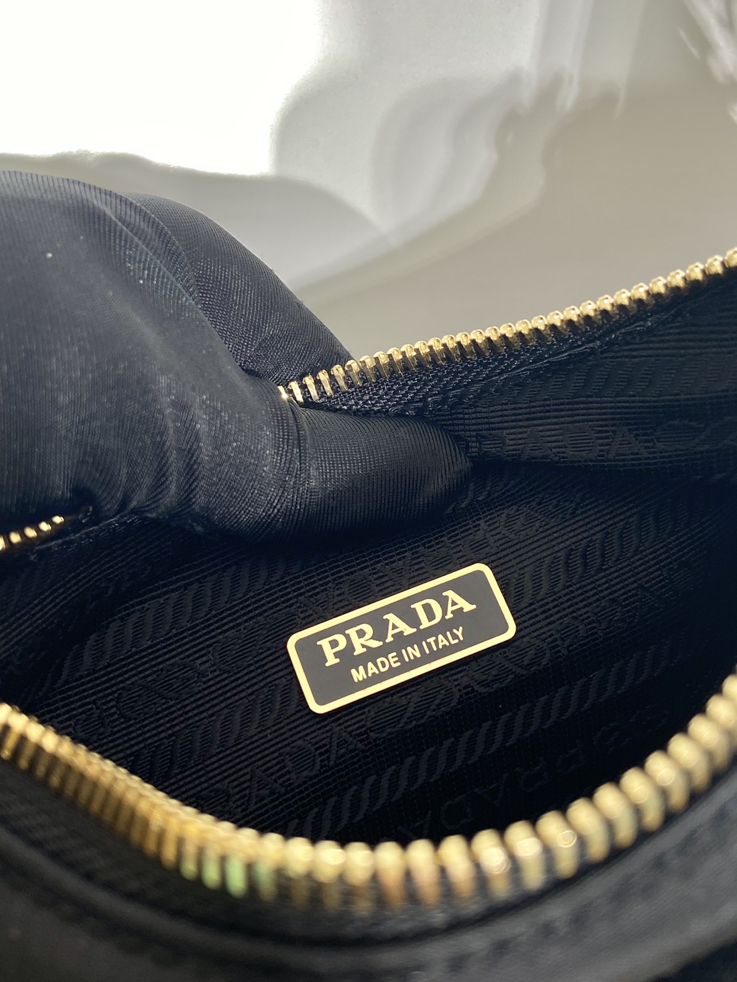 Pra*a re-nylon and brushed leather mini-bag