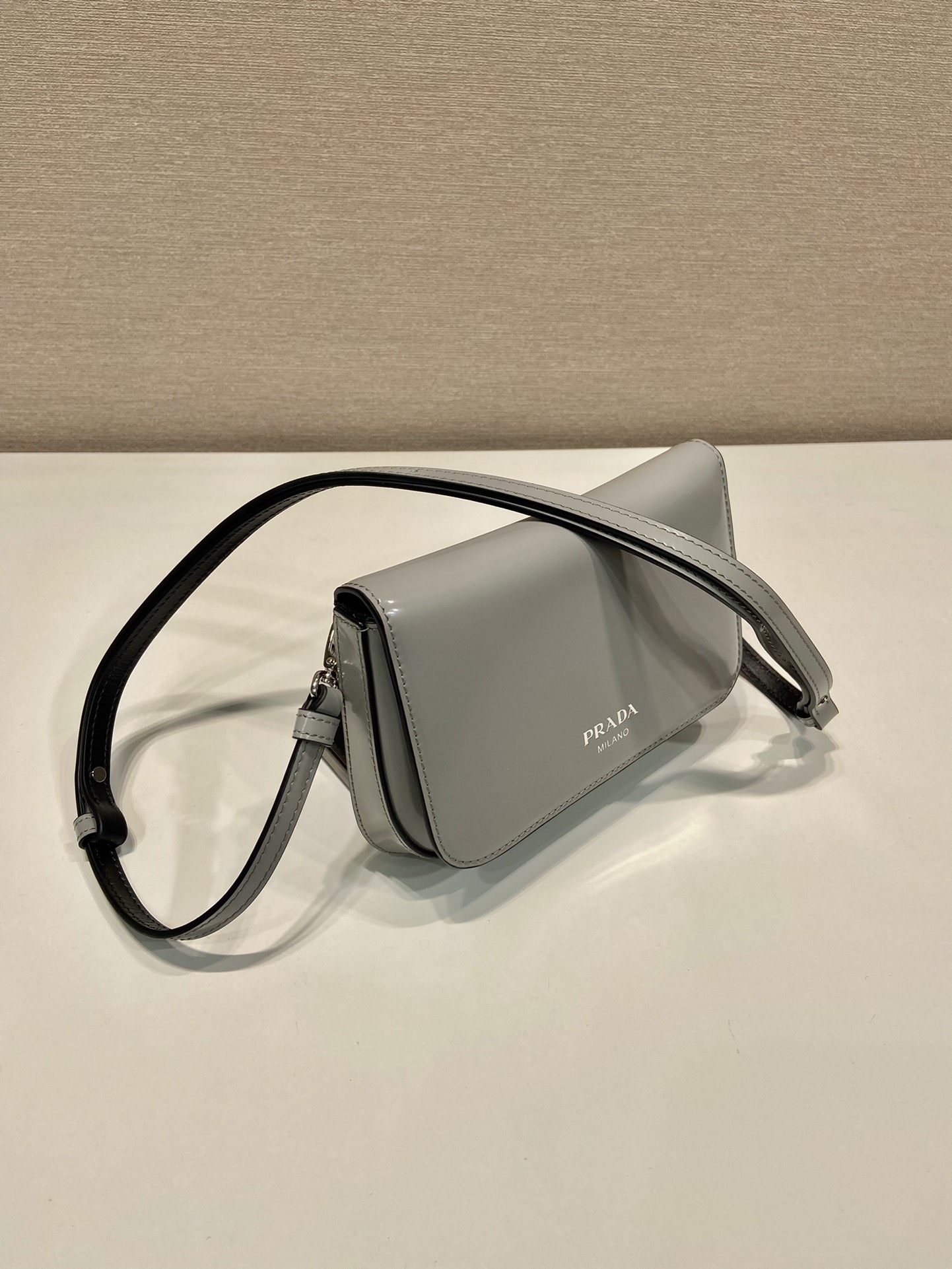 Pra*a brushed leather mini-bag with shoulder strap