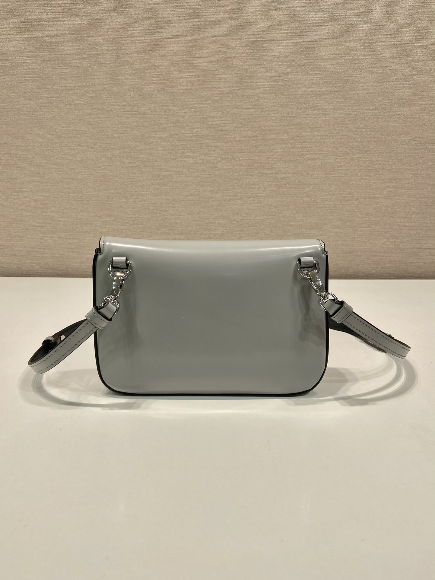 Pra*a brushed leather mini-bag with shoulder strap