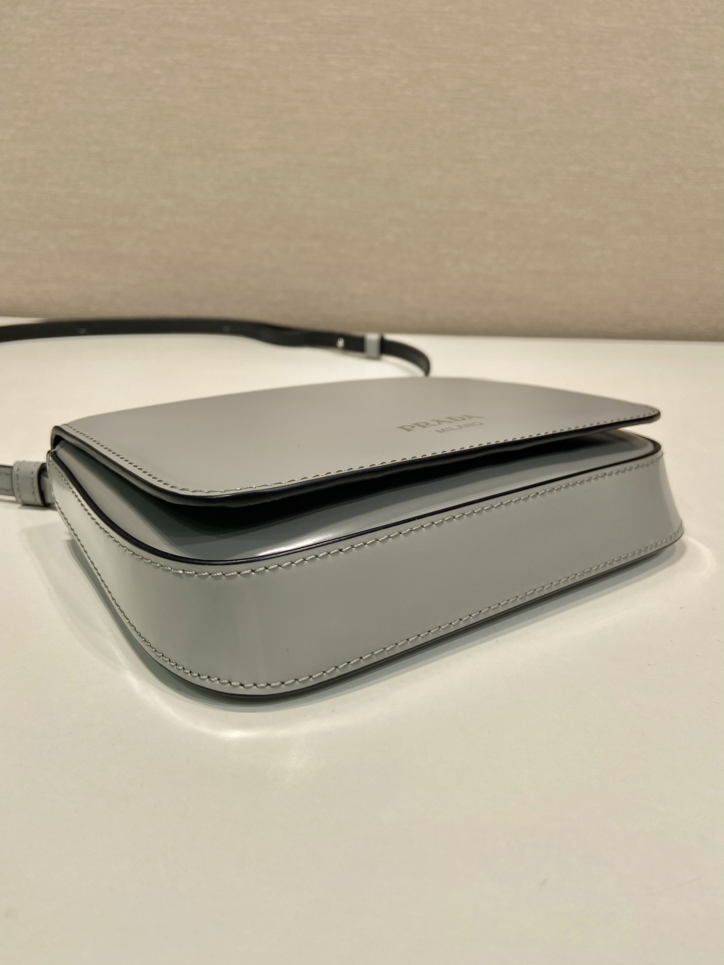 Pra*a brushed leather mini-bag with shoulder strap