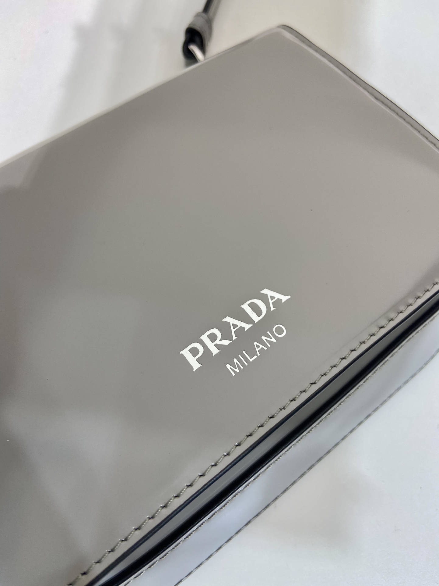 Pra*a brushed leather mini-bag with shoulder strap
