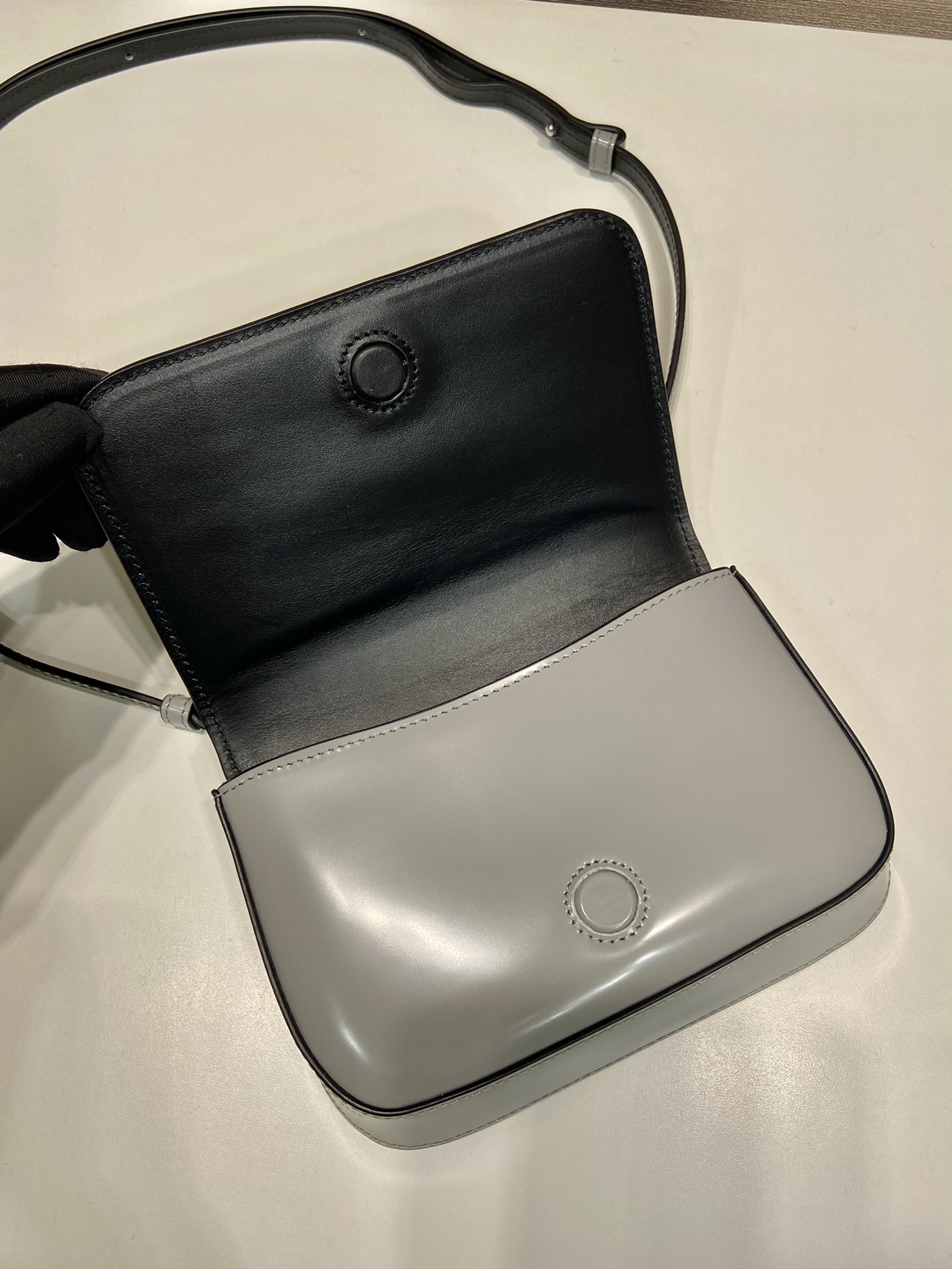 Pra*a brushed leather mini-bag with shoulder strap