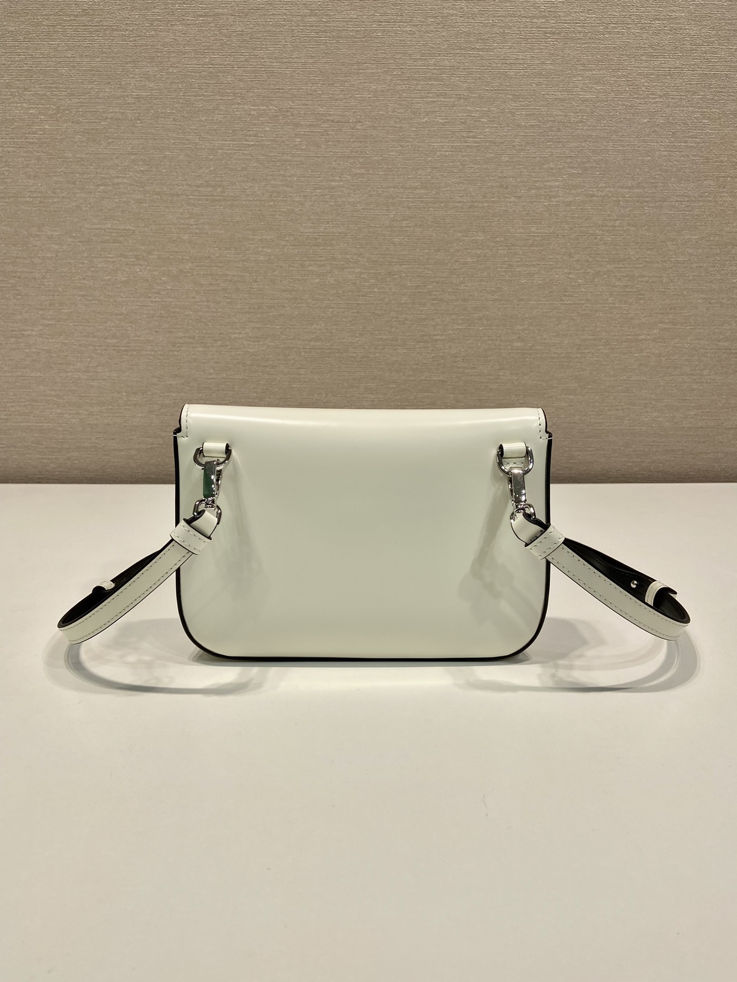 Pra*a brushed leather mini-bag with shoulder strap