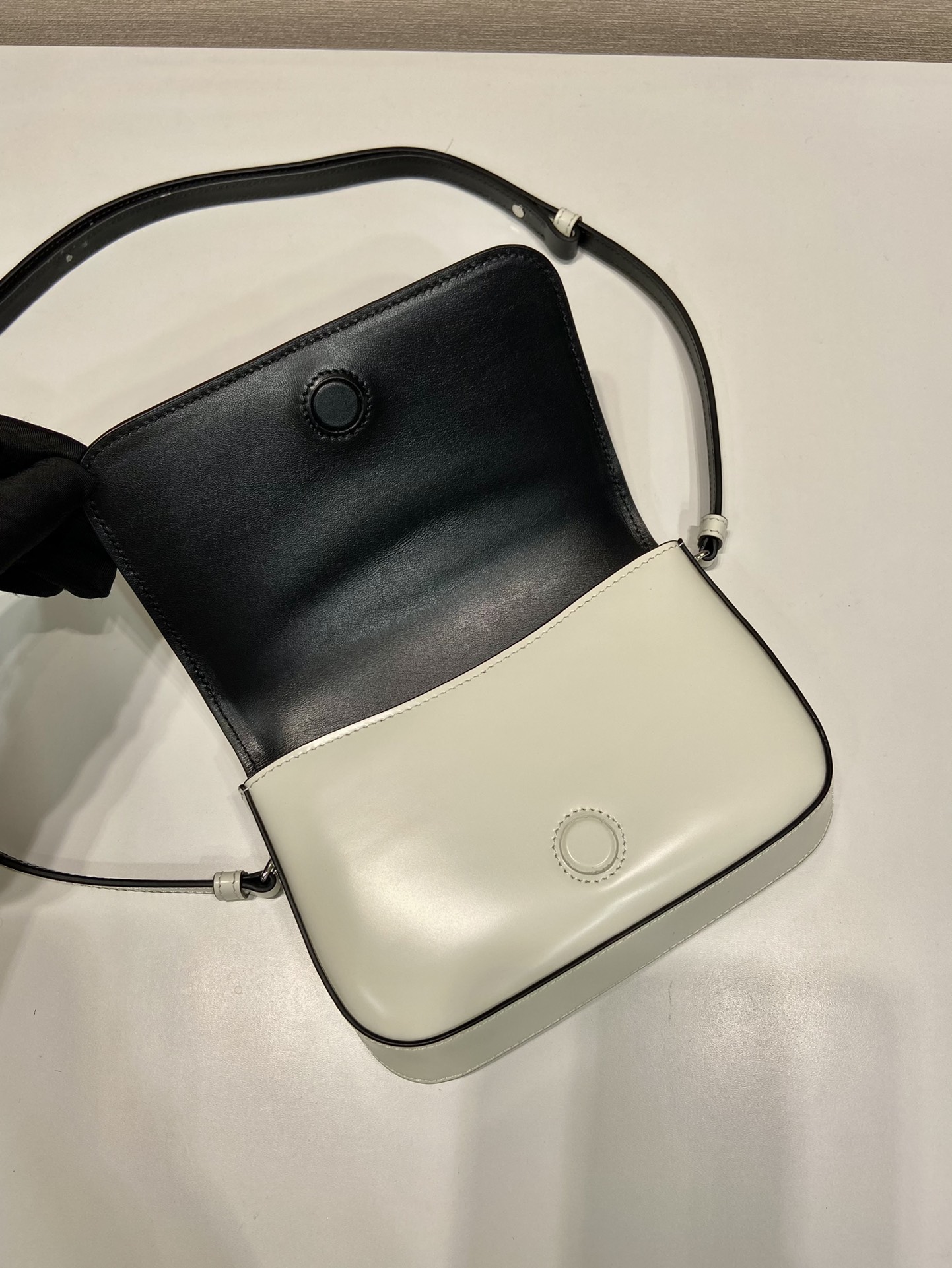 Pra*a brushed leather mini-bag with shoulder strap