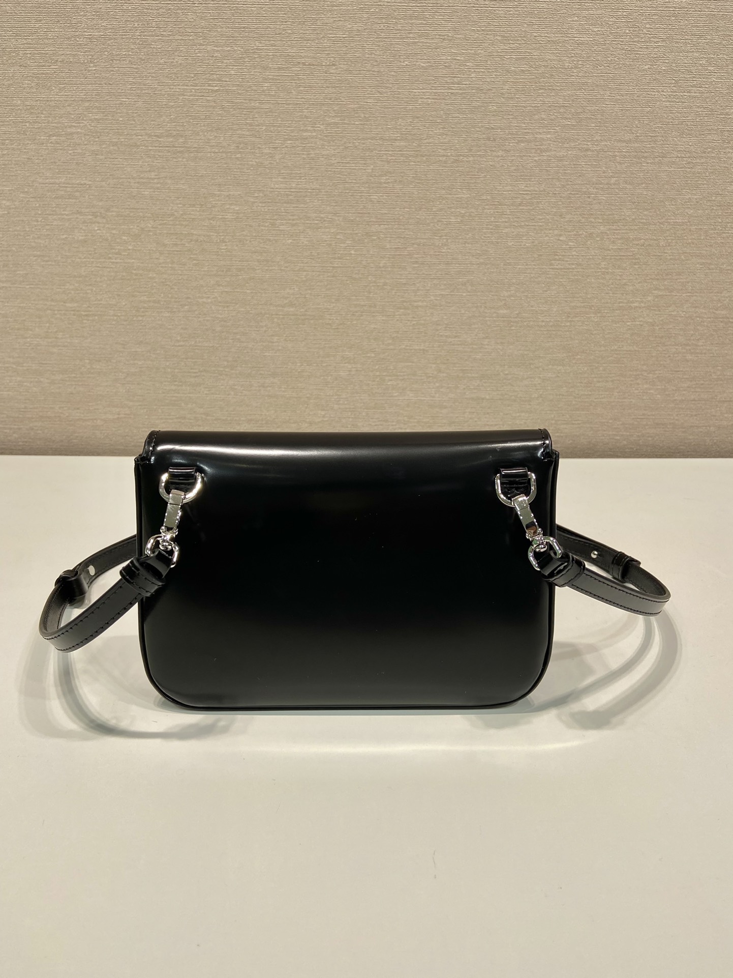 Pra*a brushed leather mini-bag with shoulder strap