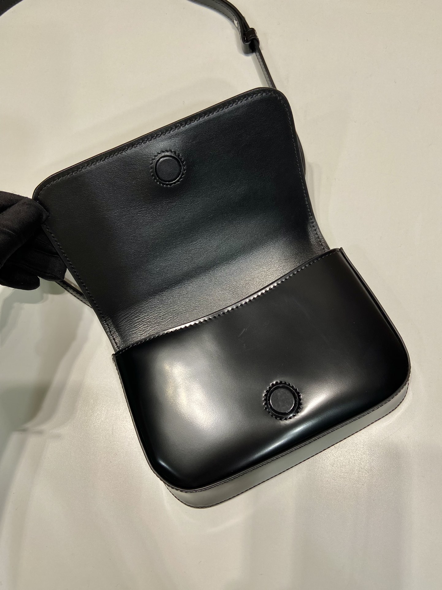 Pra*a brushed leather mini-bag with shoulder strap