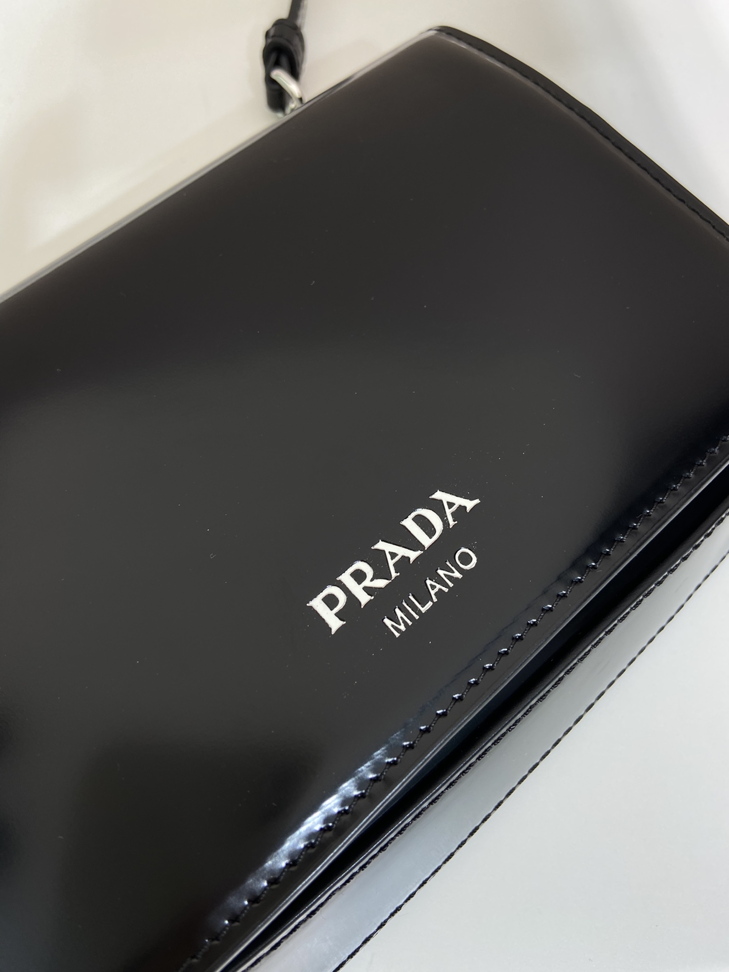 Pra*a brushed leather mini-bag with shoulder strap