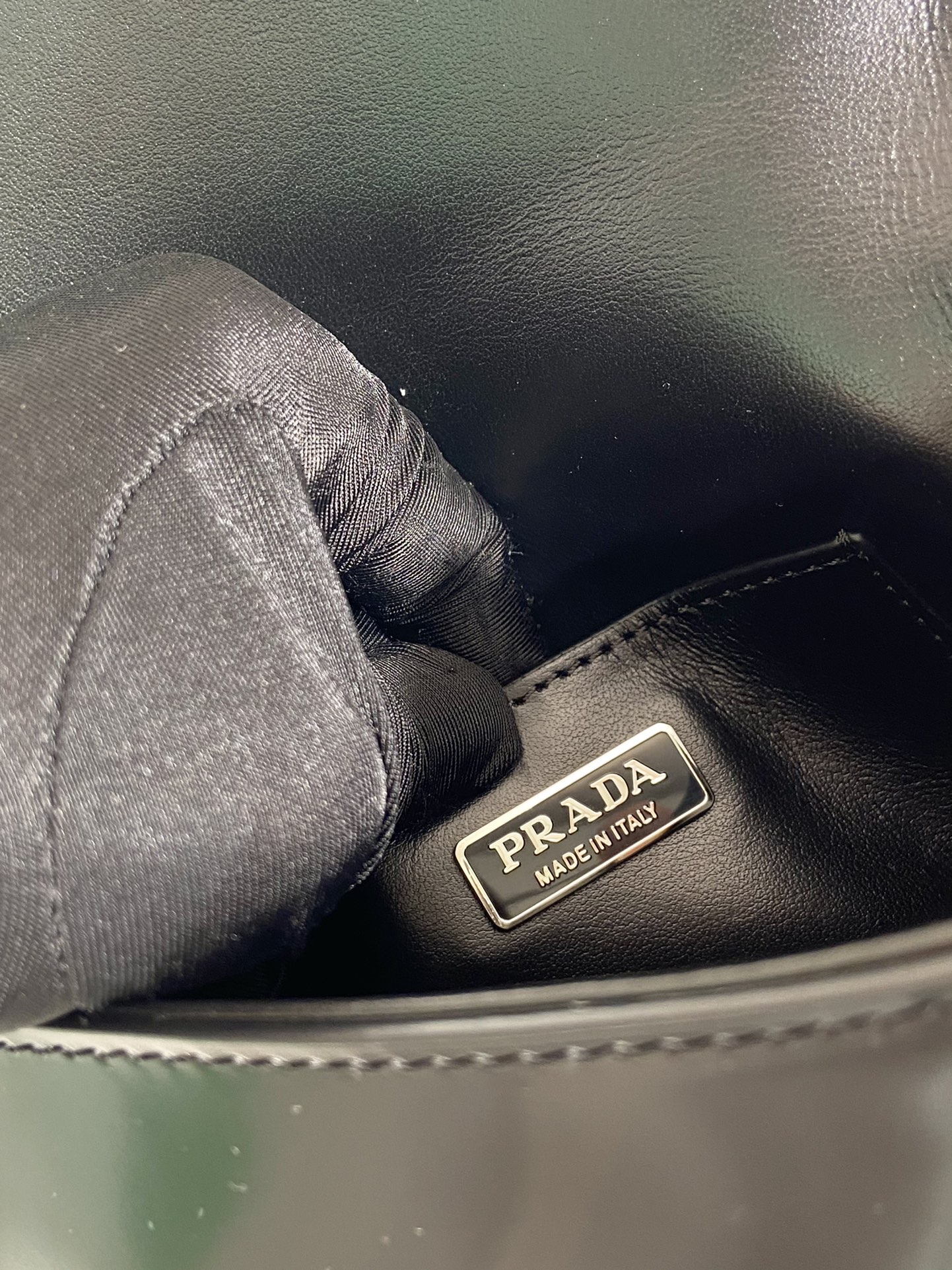 Pra*a brushed leather mini-bag with shoulder strap