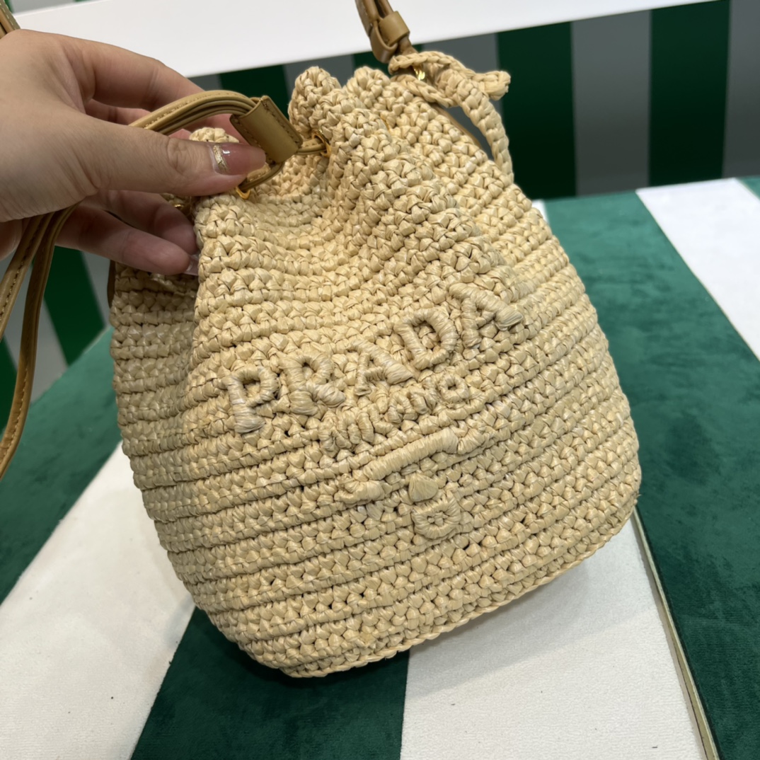 Pra*a crochet and leather mini-bucket bag