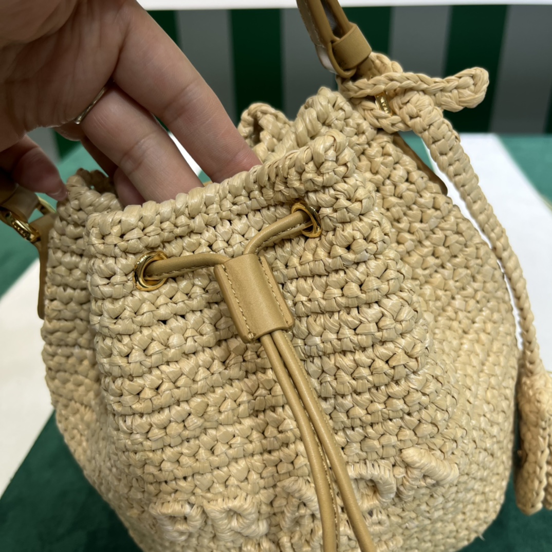 Pra*a crochet and leather mini-bucket bag