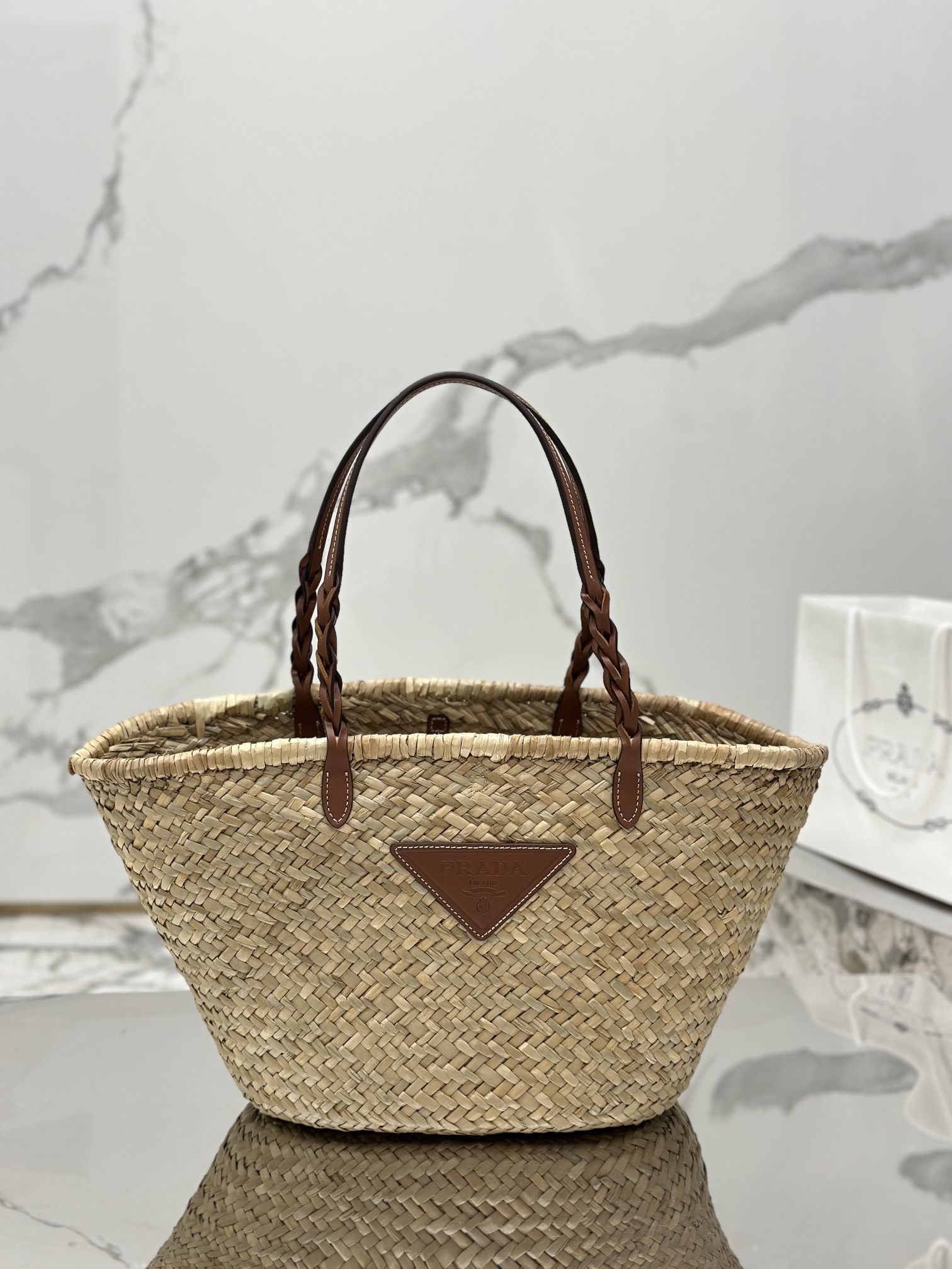 Pra*a woven palm and leather tote