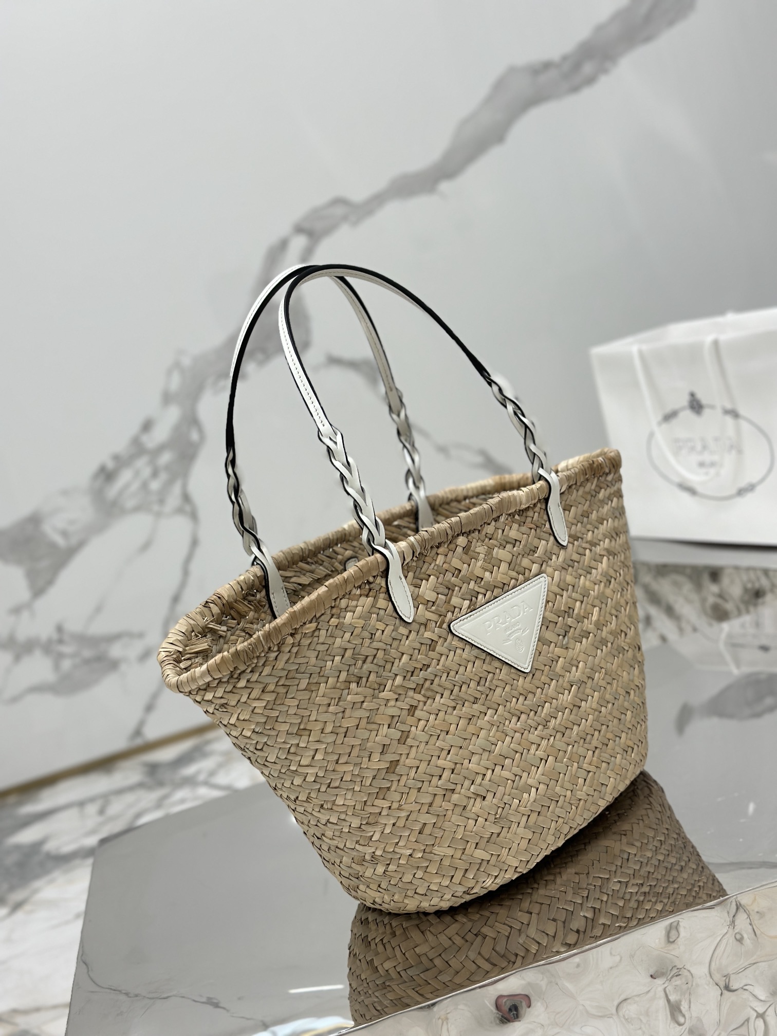 Pra*a woven palm and leather tote