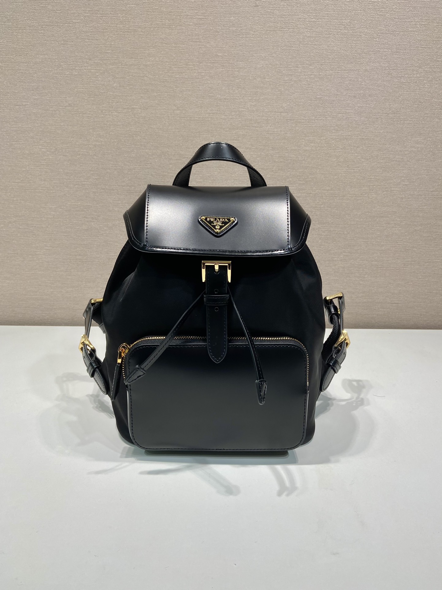 Pra*a re-nylon and brushed leather backpack
