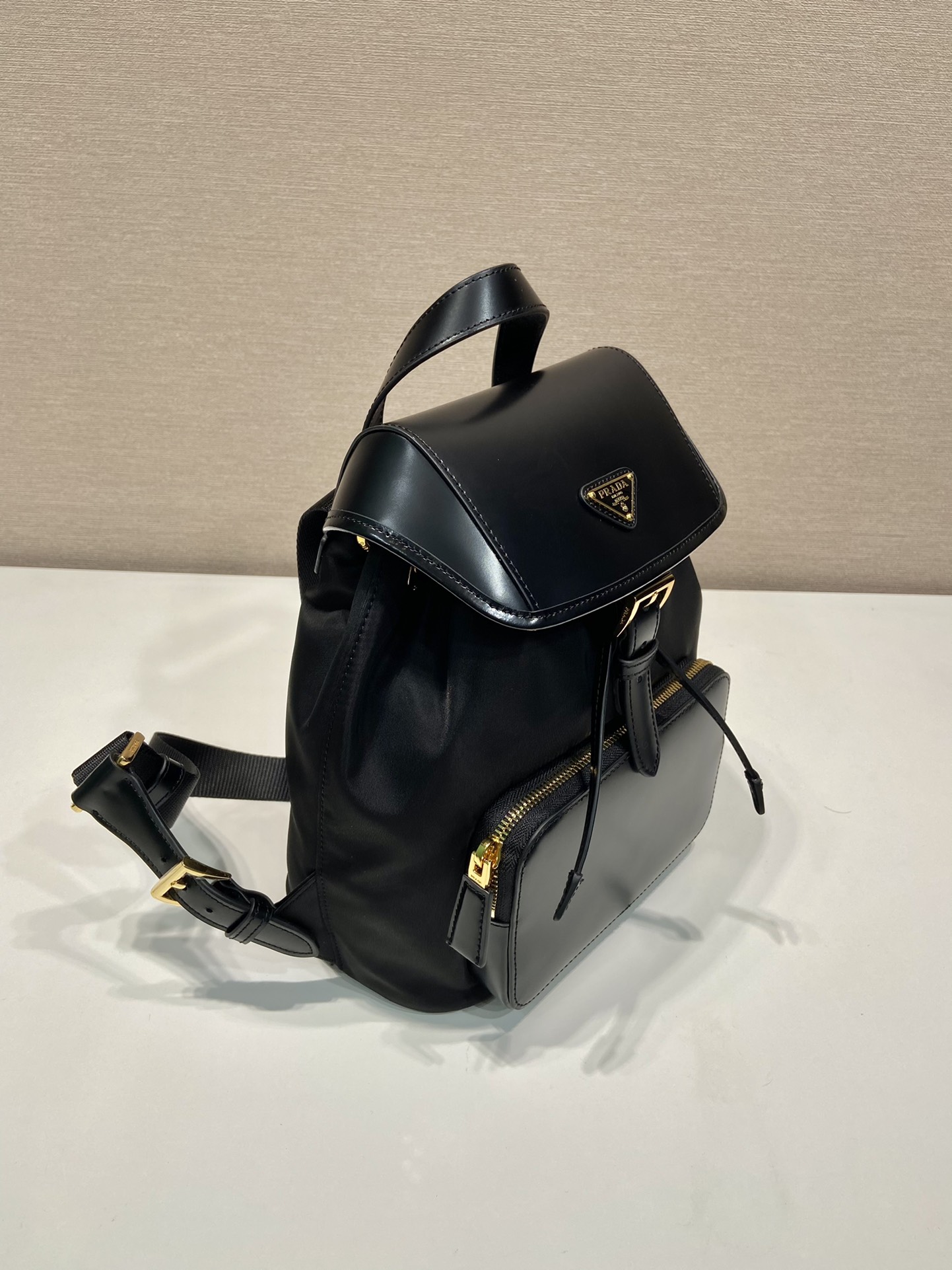 Pra*a re-nylon and brushed leather backpack
