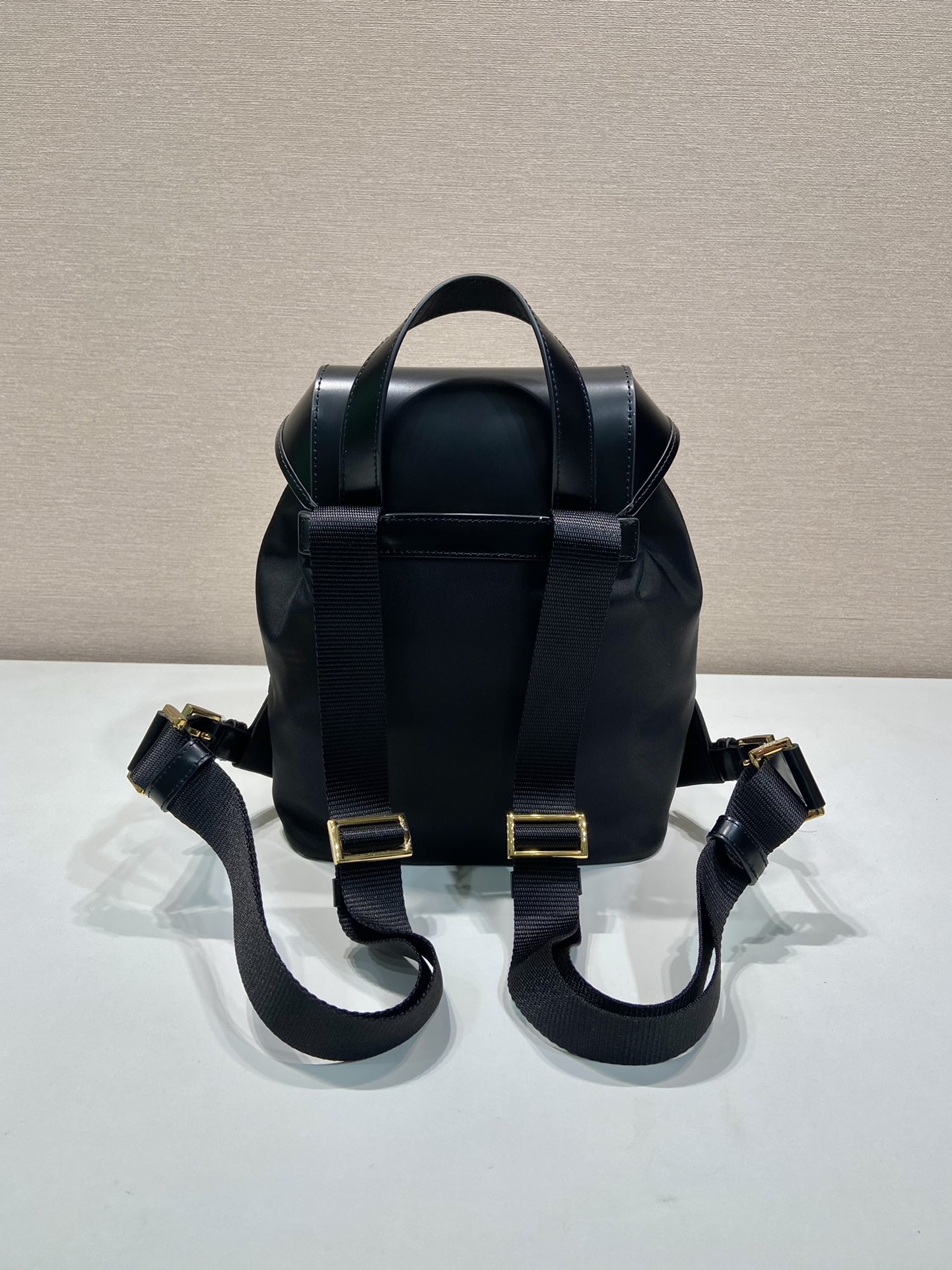 Pra*a re-nylon and brushed leather backpack