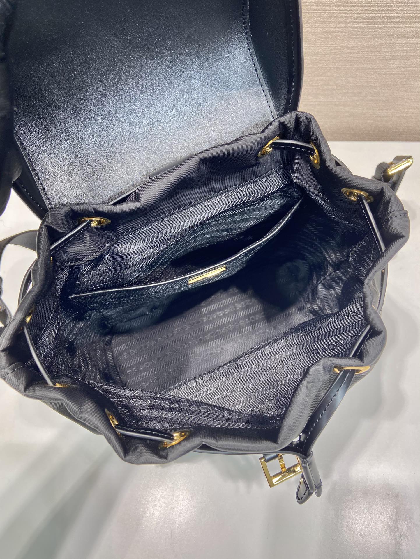 Pra*a re-nylon and brushed leather backpack