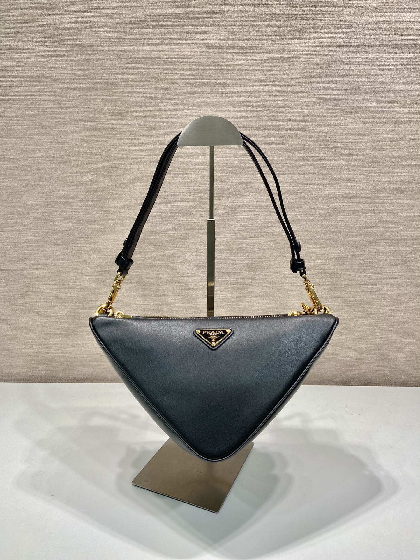 Pra*a symbole leather and fabric mini bag