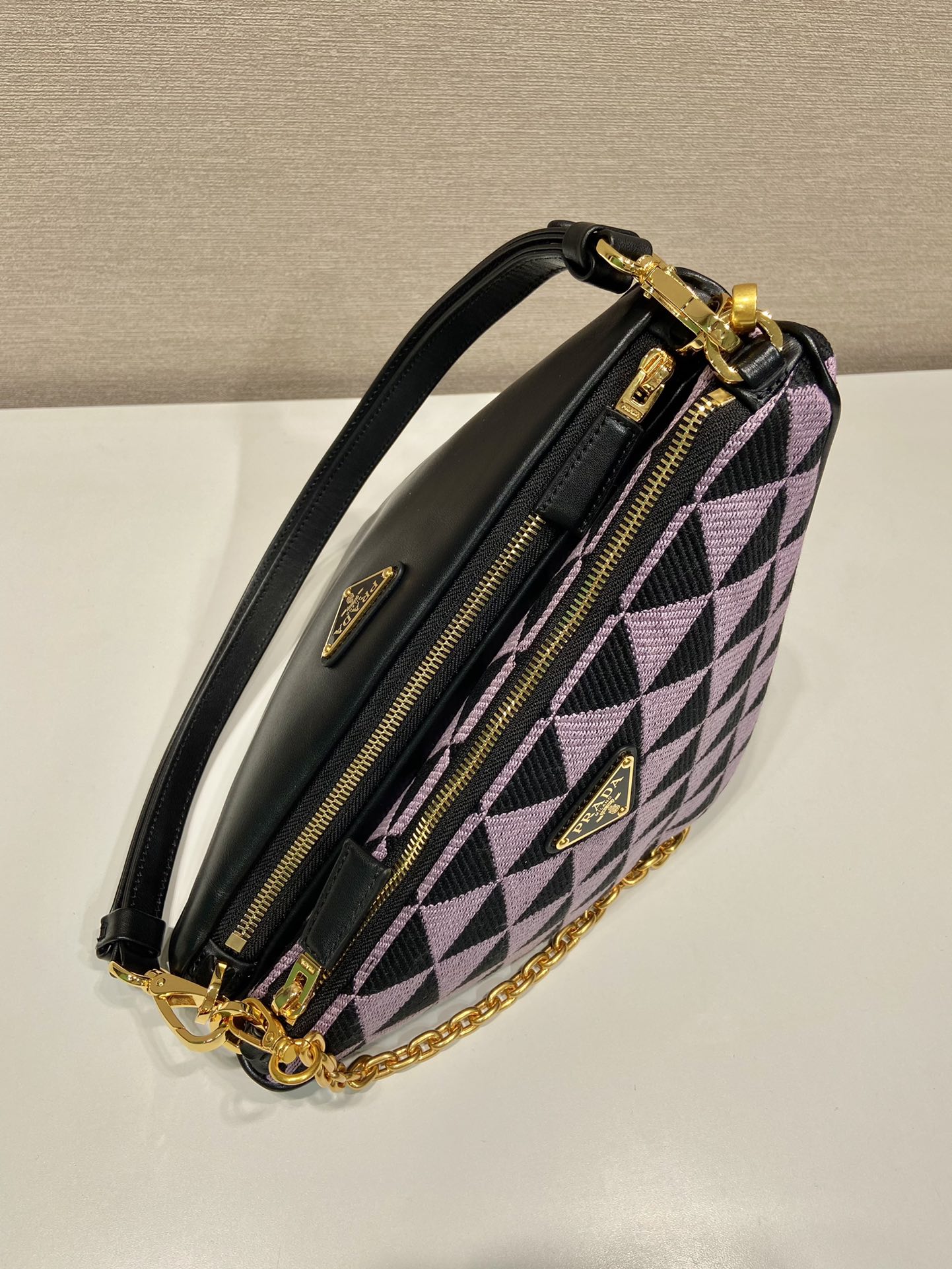 Pra*a symbole leather and fabric mini bag