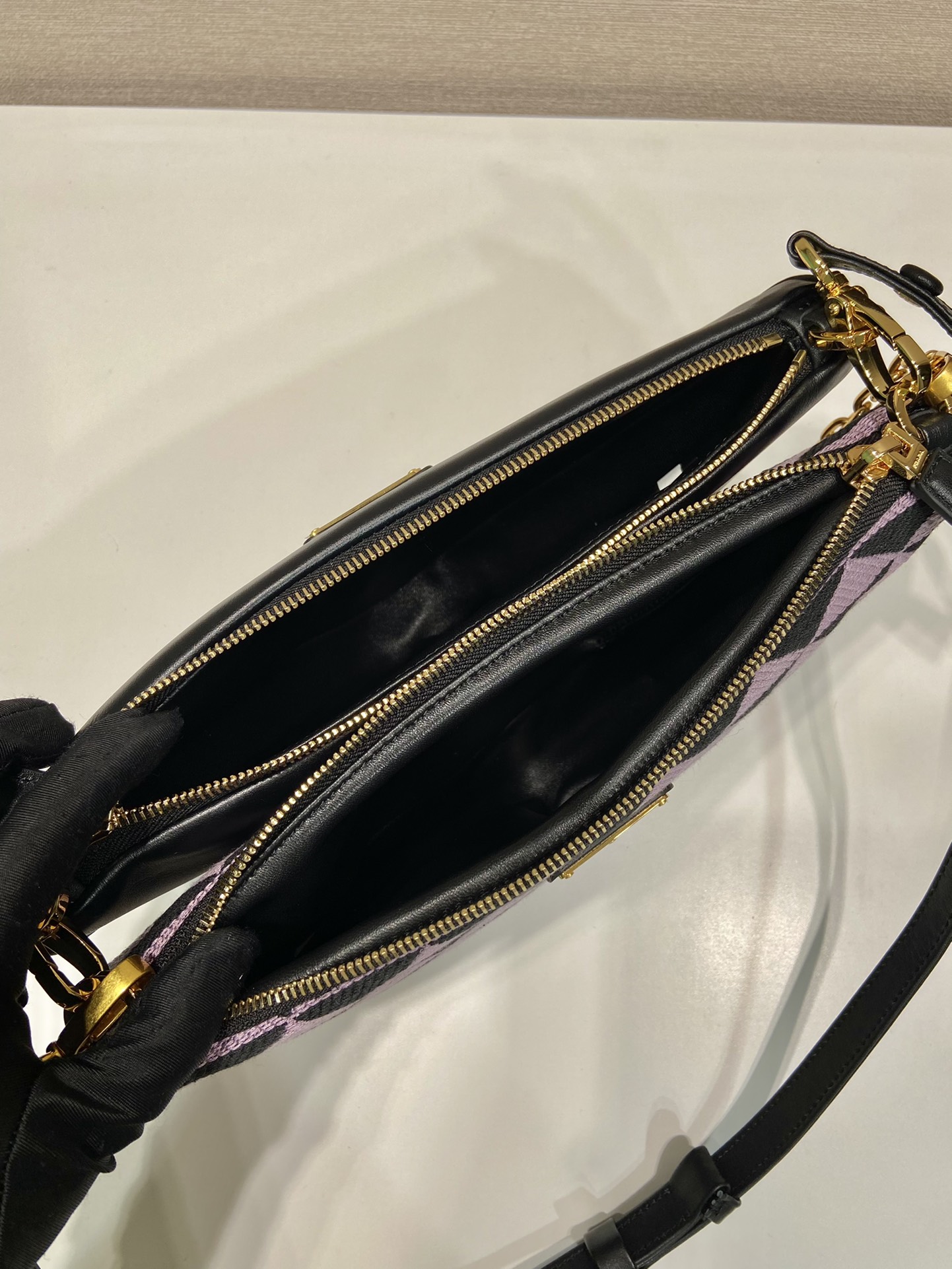Pra*a symbole leather and fabric mini bag