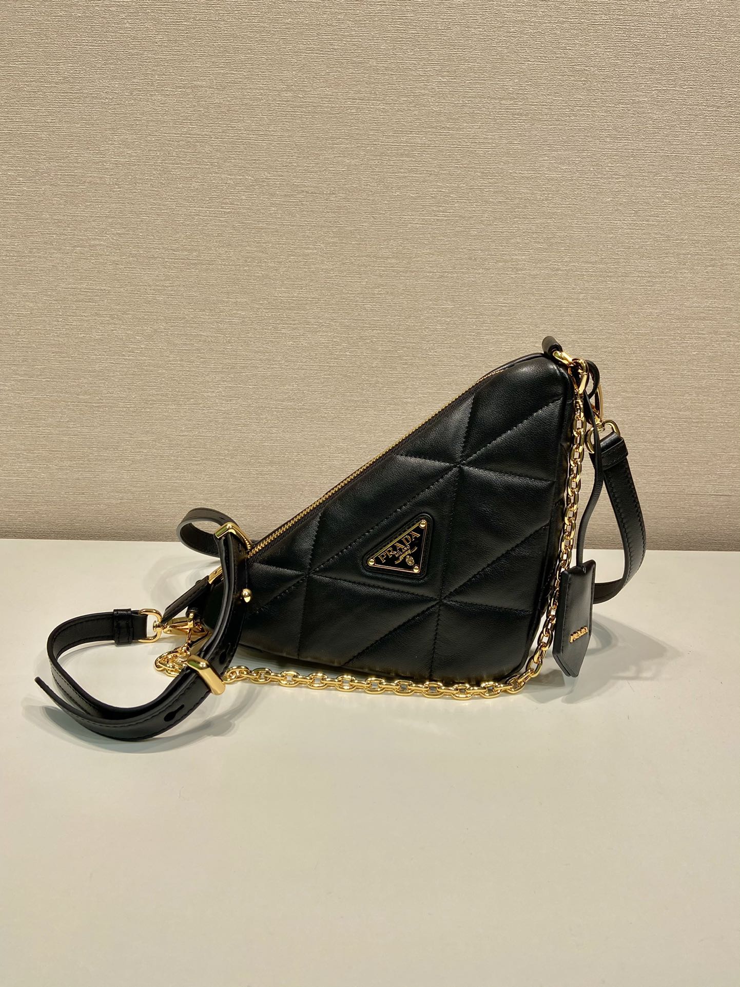 Pra*a triangle leather shoulder bag