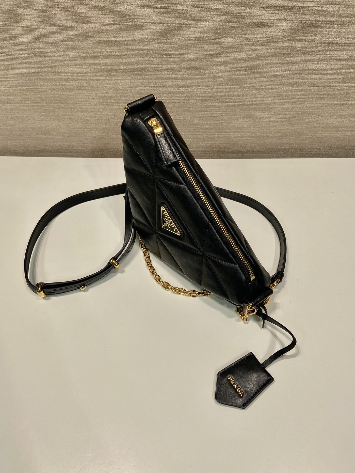 Pra*a triangle leather shoulder bag
