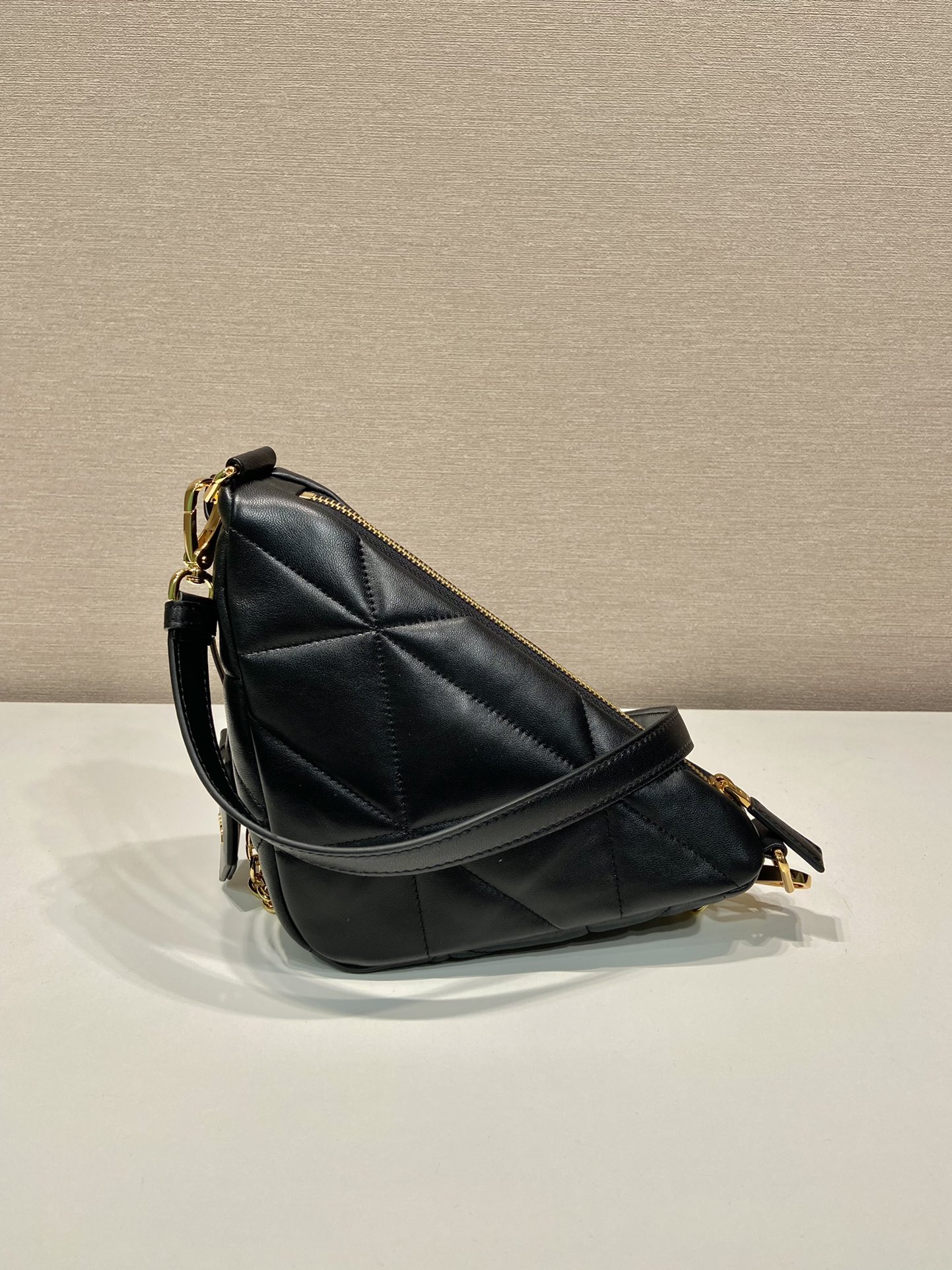 Pra*a triangle leather shoulder bag