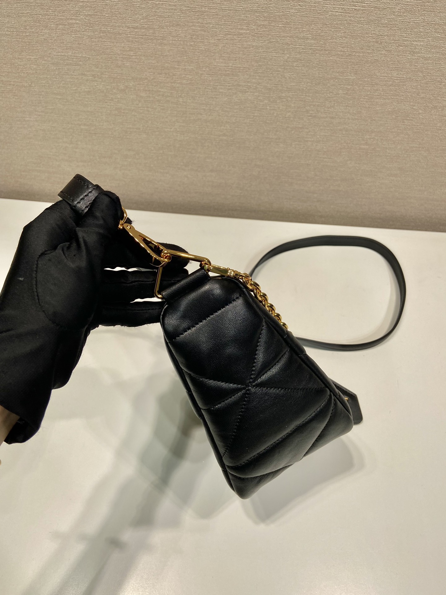 Pra*a triangle leather shoulder bag
