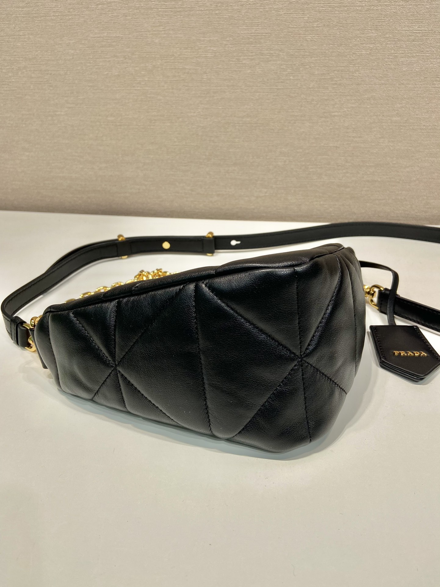 Pra*a triangle leather shoulder bag