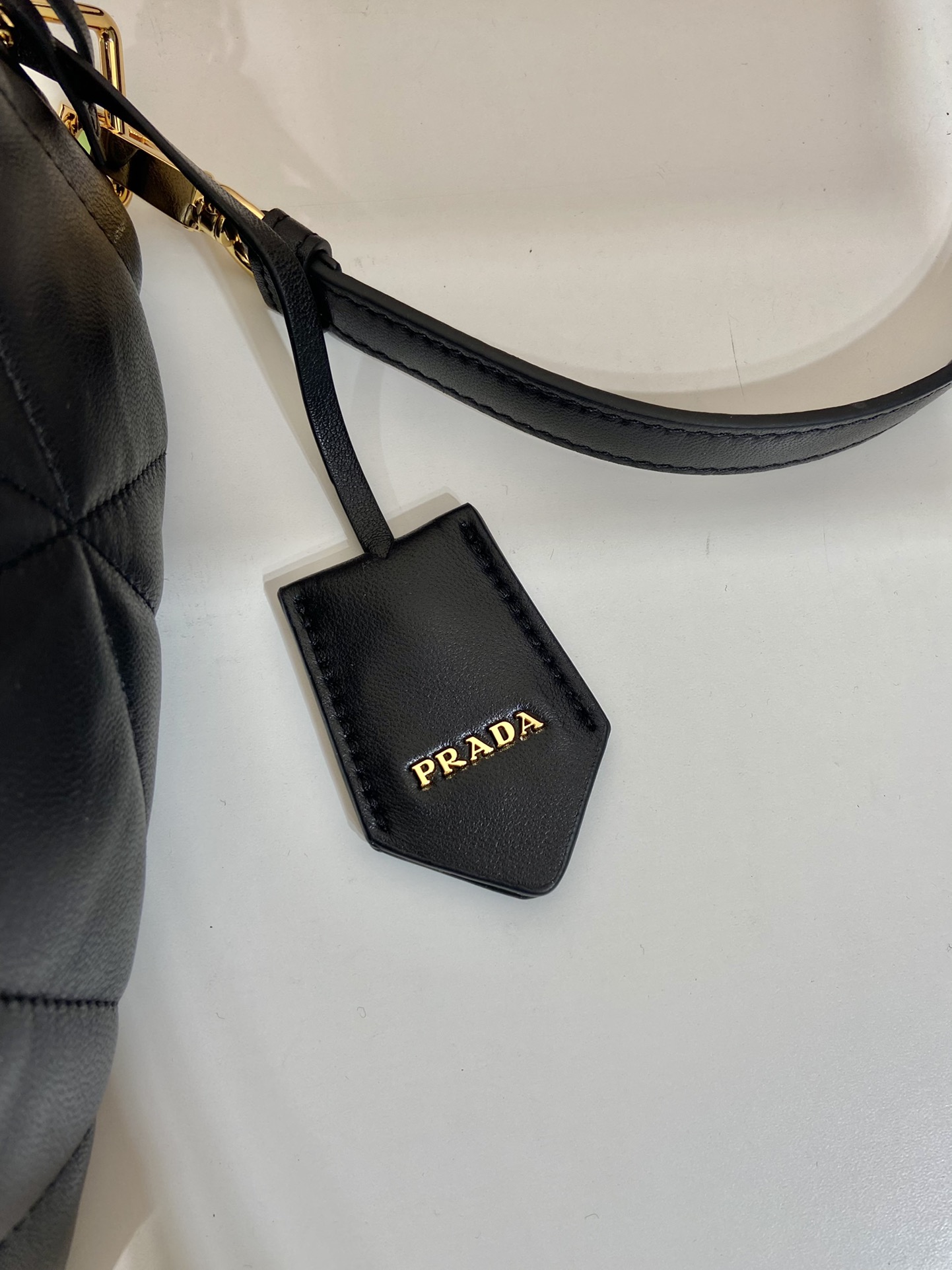 Pra*a triangle leather shoulder bag