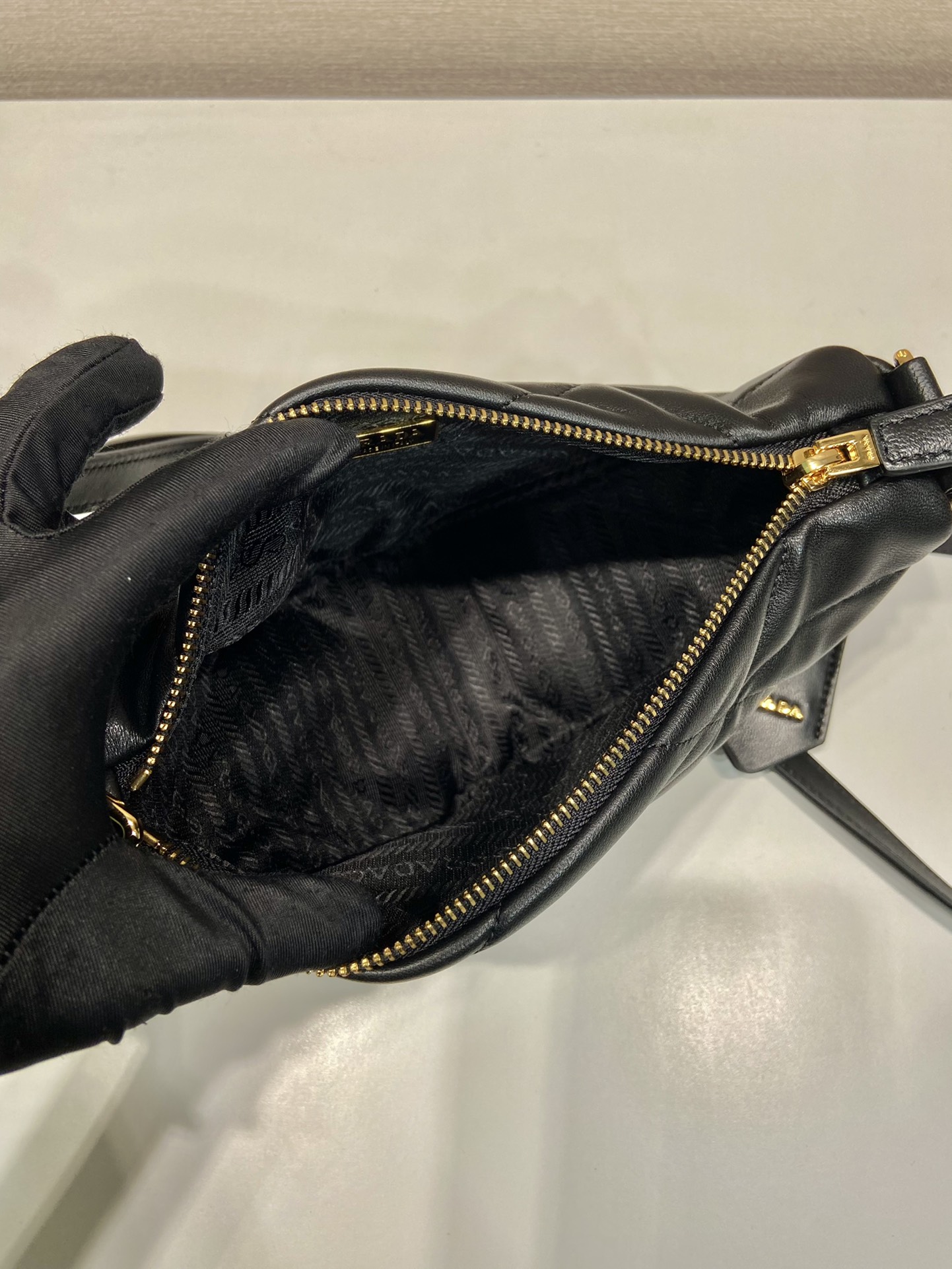 Pra*a triangle leather shoulder bag