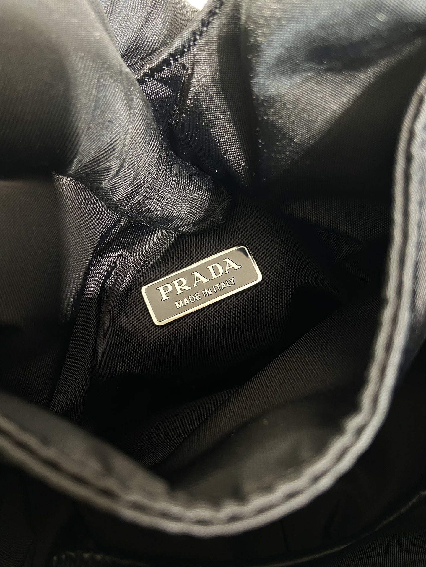 Pra*a soft padded re-nylon mini-bag