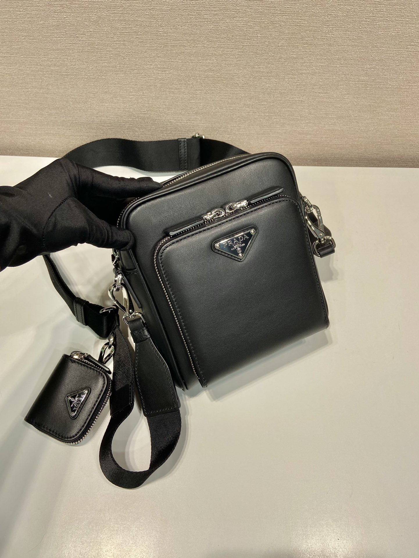 Pra*a leather shoulder bag with pouch